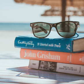 sunglasses on a set of book