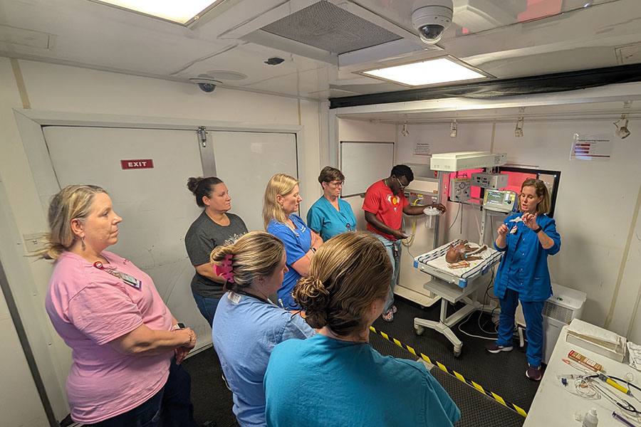 Instructor speaking to nurses Simulator training